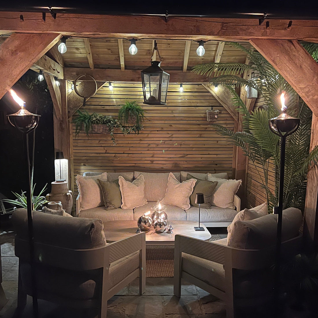 garden seating area with outdoor oil torches