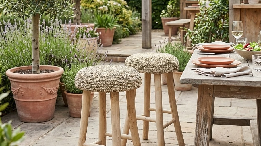 garden patio with dinner table set and wicker bar stools