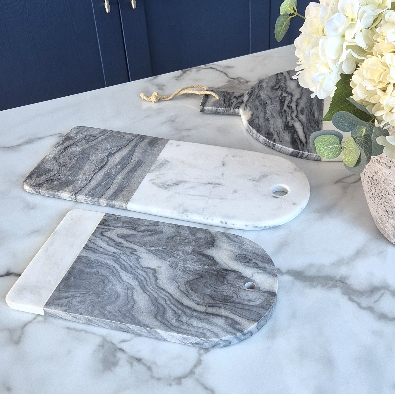 marble chopping boards on kitchen counter