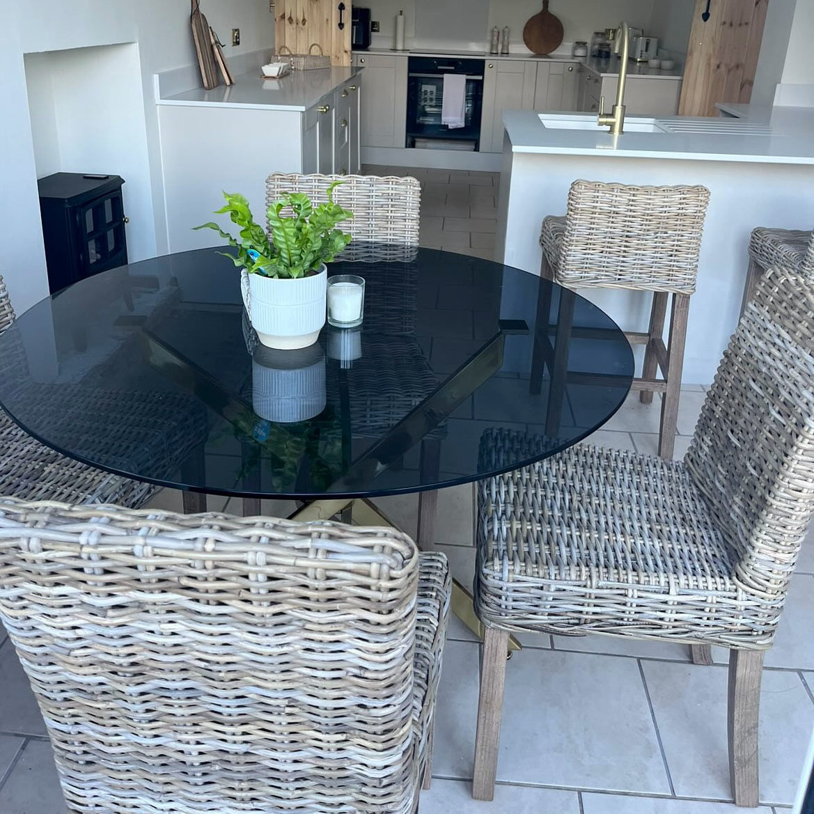 Wicker dining chair in kitchen with dining table