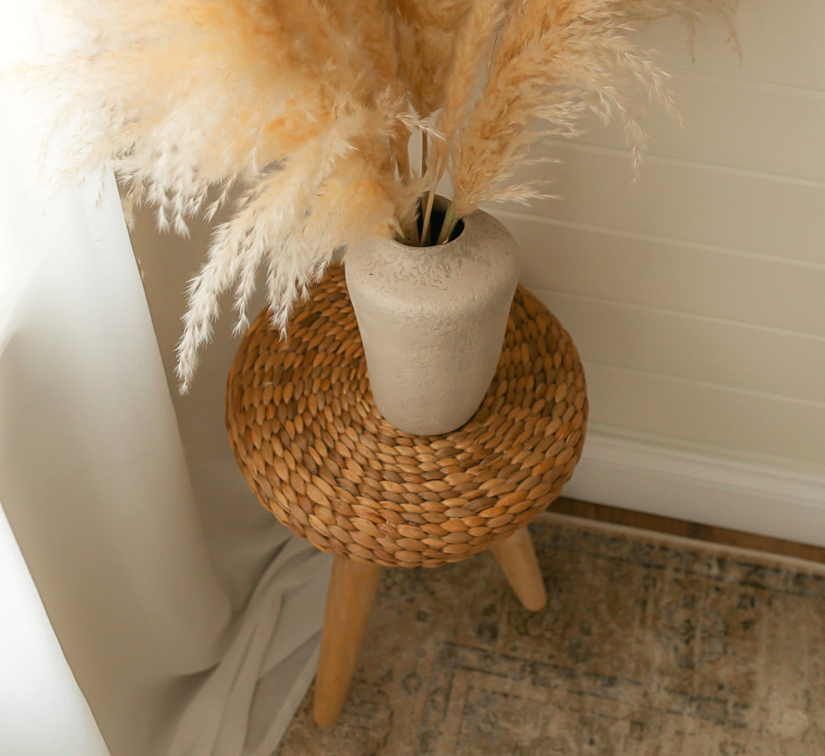 Wicker stool in bedroom