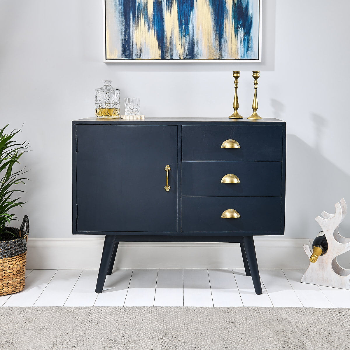 Navy blue sideboard on wooden floor with rug
