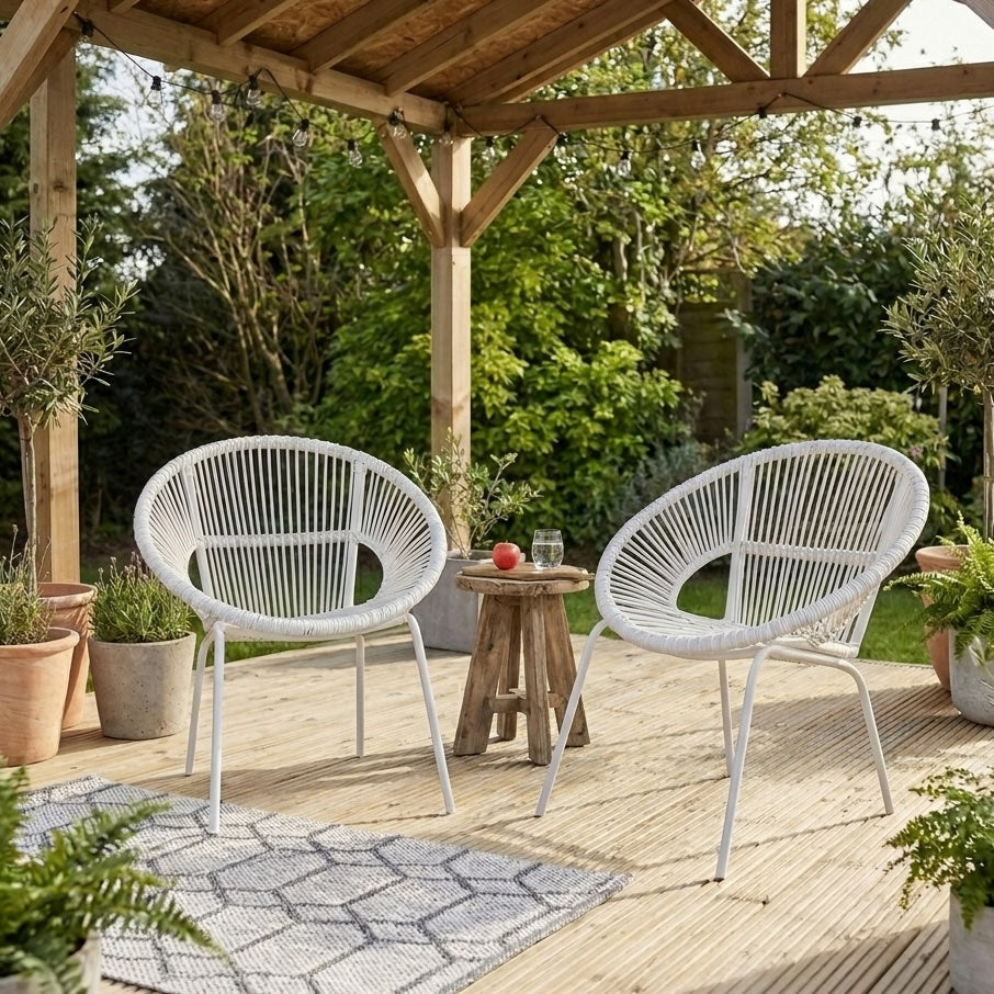 white garden chairs on wooden decking