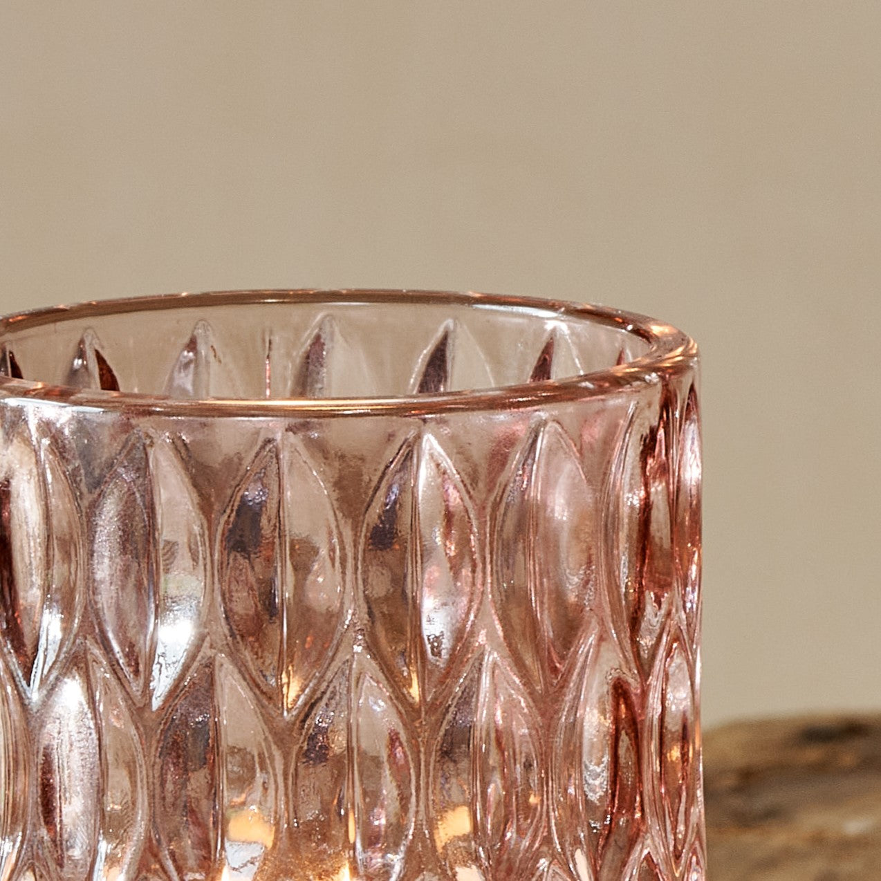 Clos up of top of pink glass tealight holder