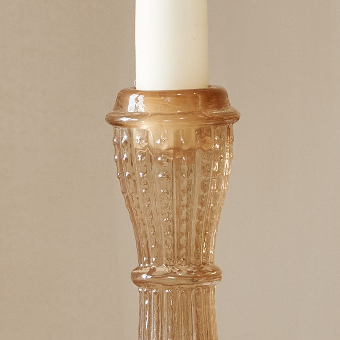 Close up of pink glass candlestick