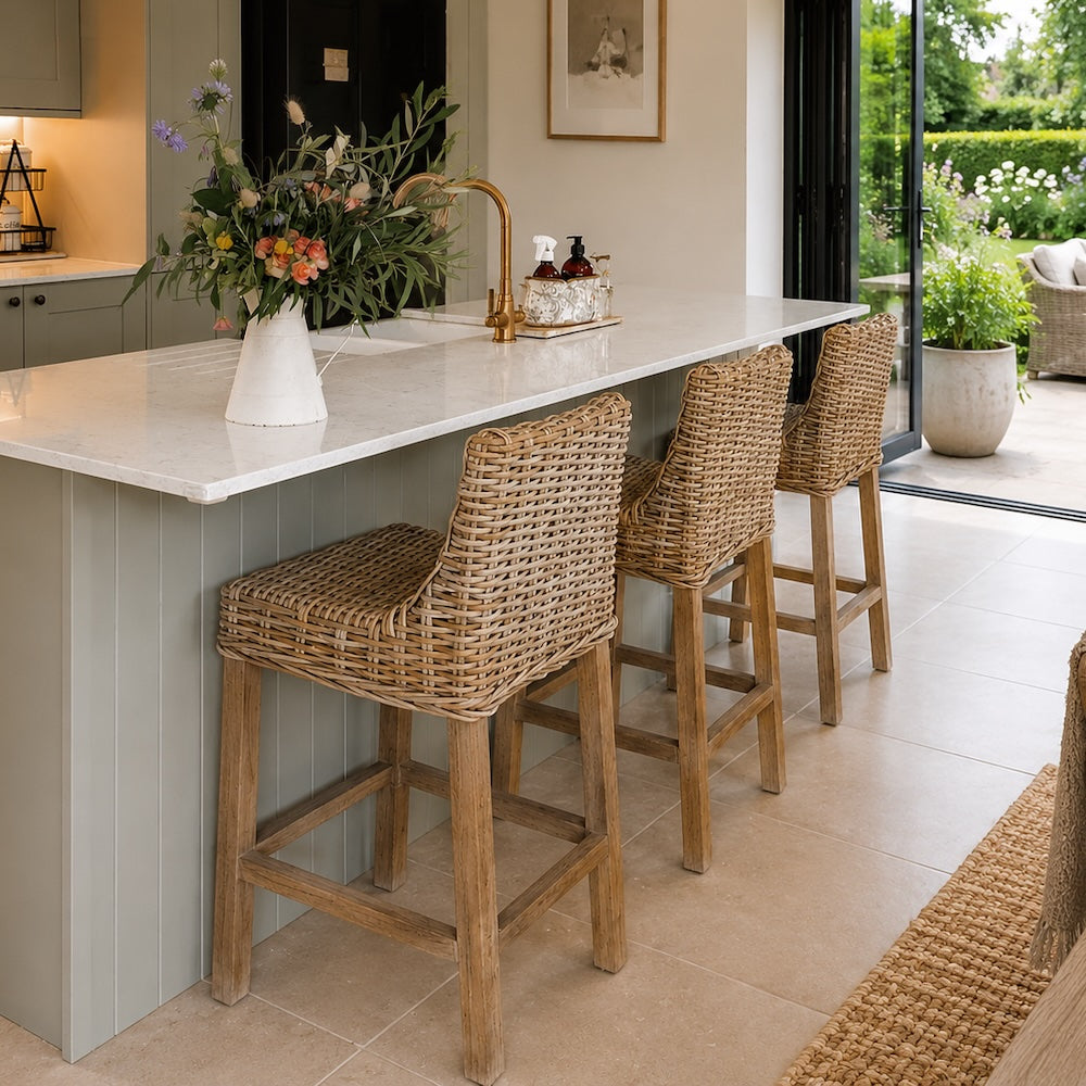 country kitchen with granite island and rattan kitchen stools
