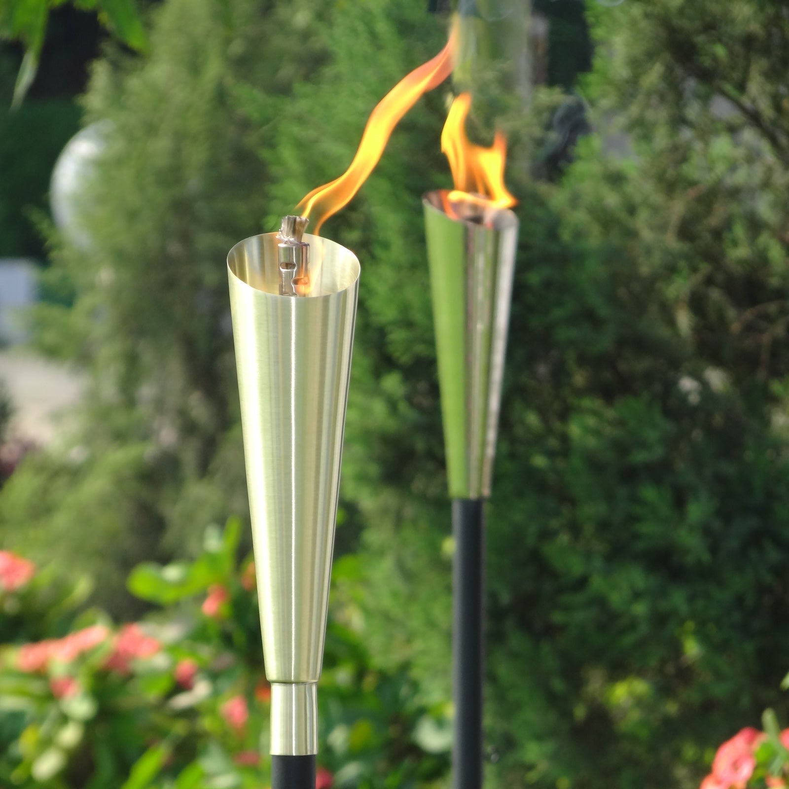 Garden oil torch Silver in garden