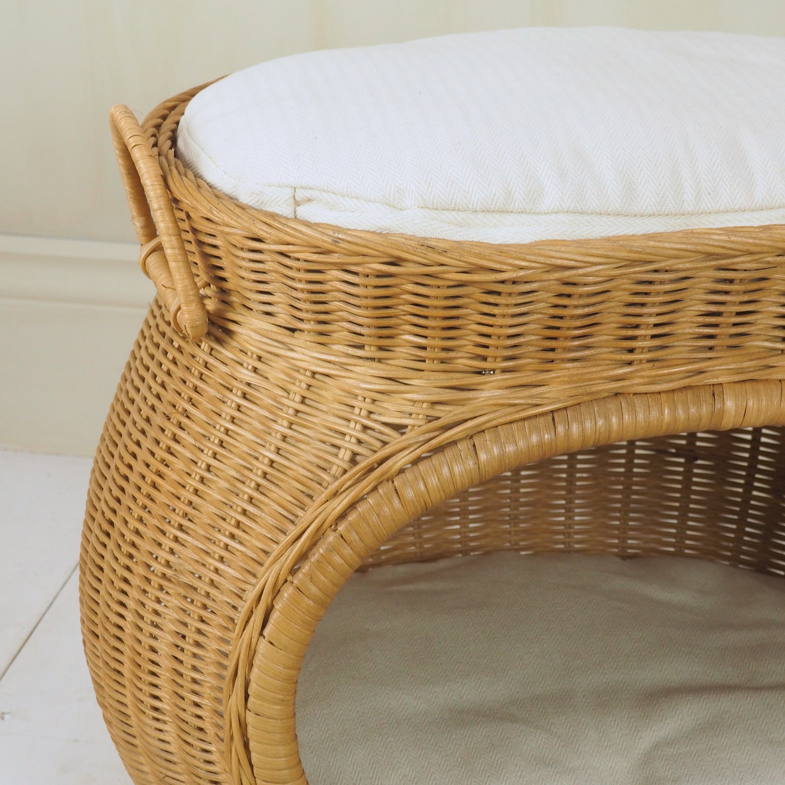detailed photo of rattan cat bed with cushion