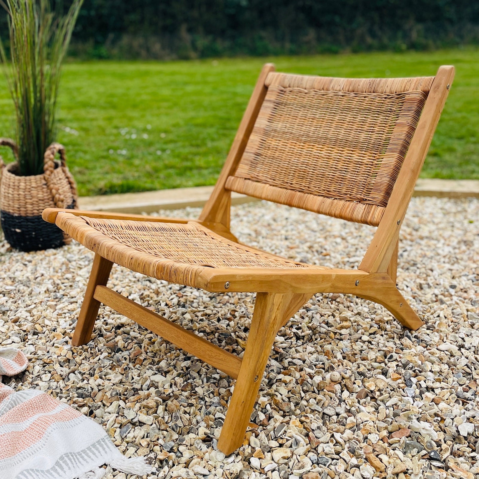 wooden garden chair with rattan on garden patio