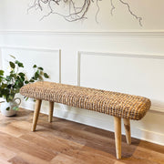 wicker hallway bench in hallway one wooden floor