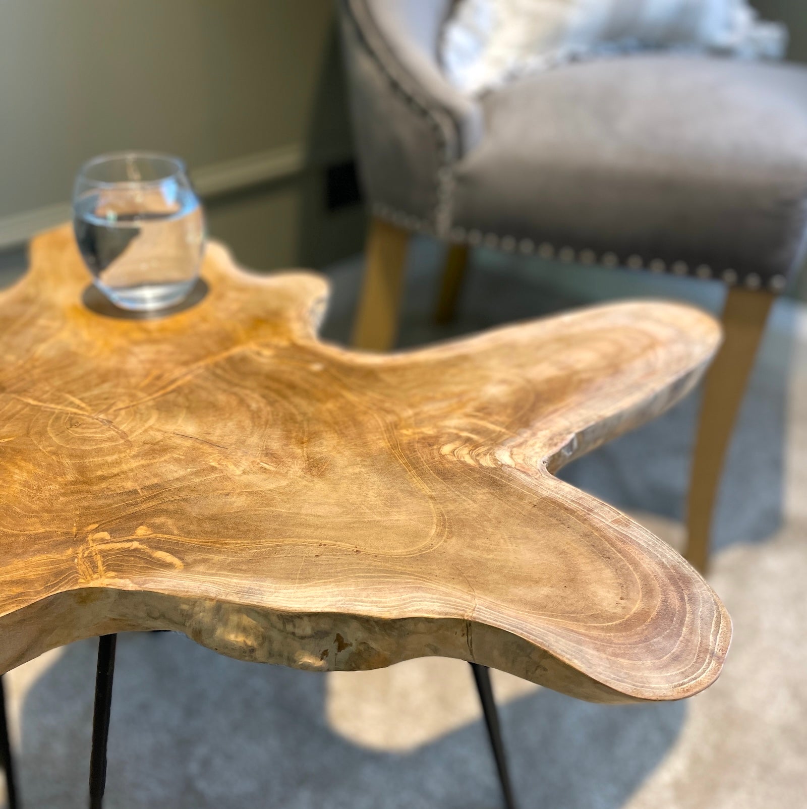 live edge coffee table detailed photo by chair