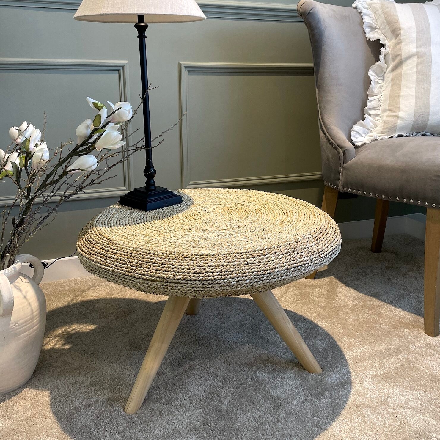 wicker coffee table in living room with table lamp