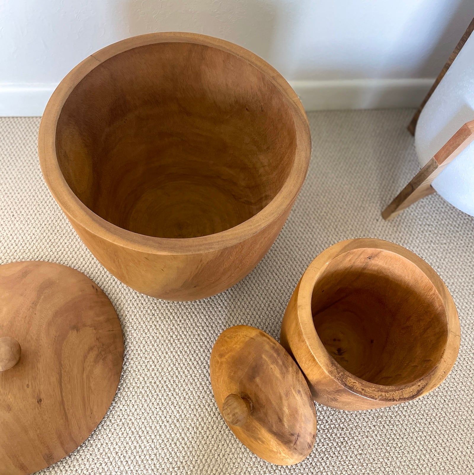 wooden pots with lids on floor
