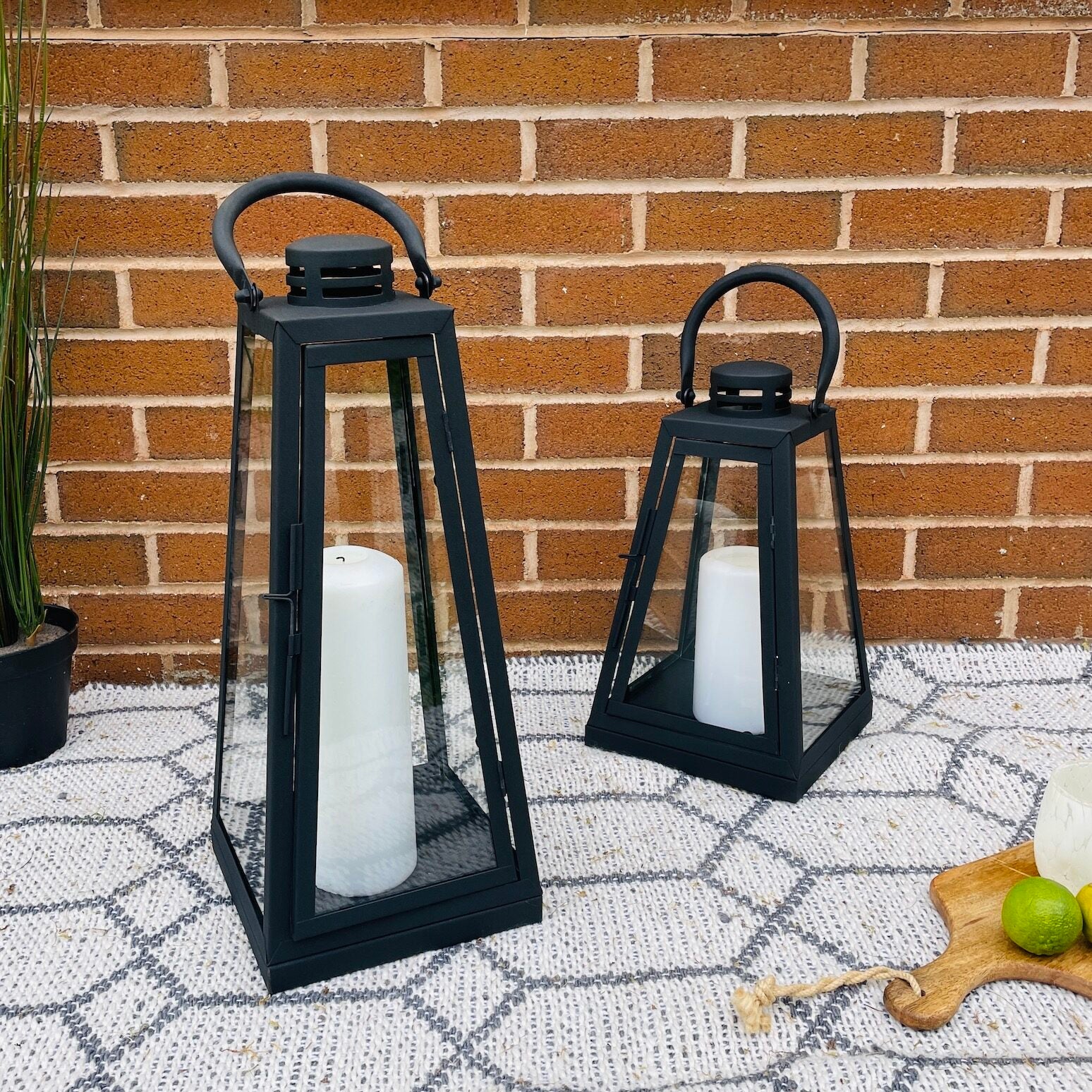 Black candle lantern in garden