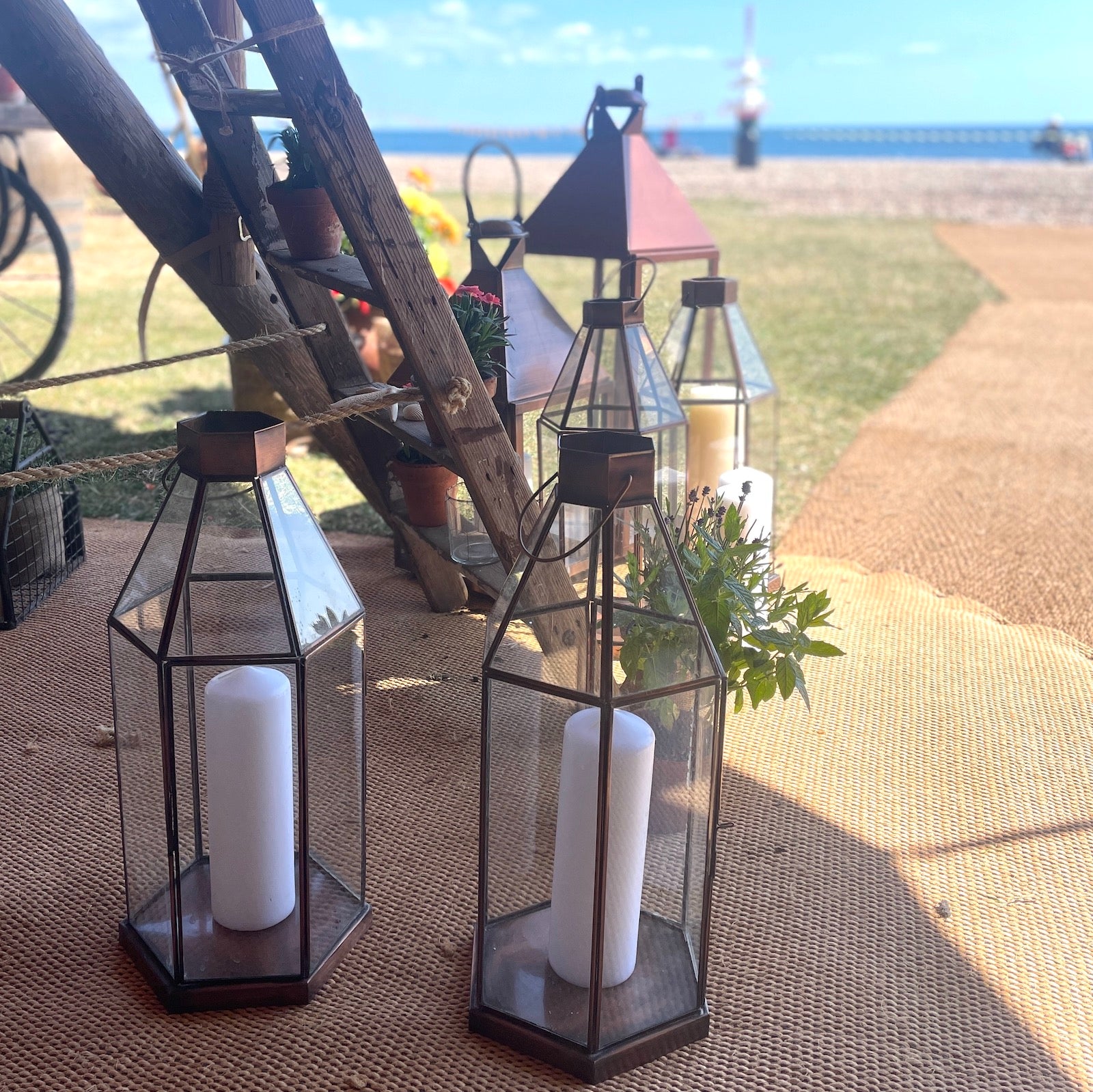brass candle lantern on beach