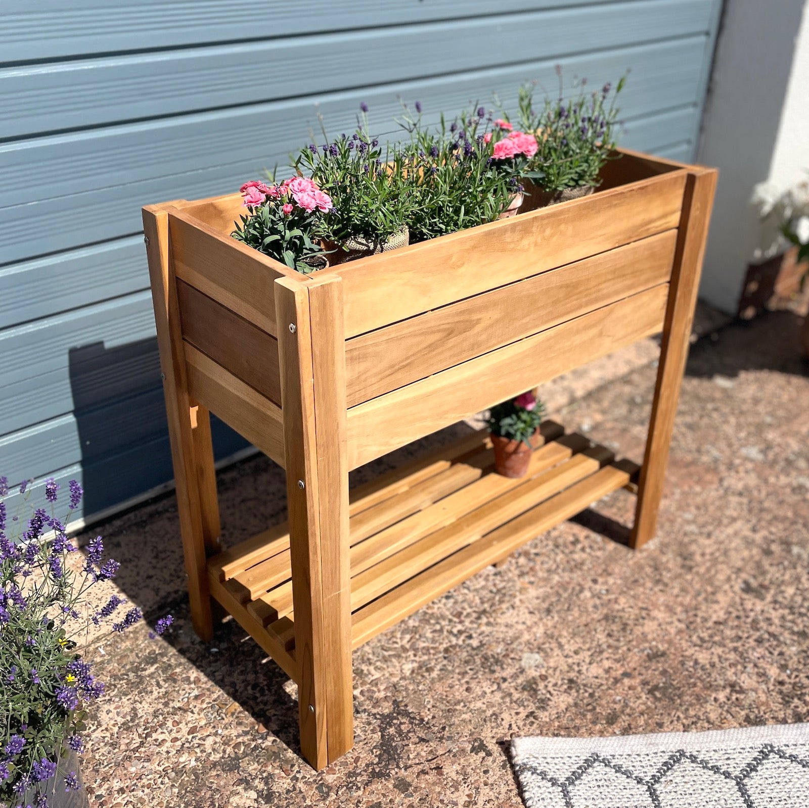 Raised wooden planter garden