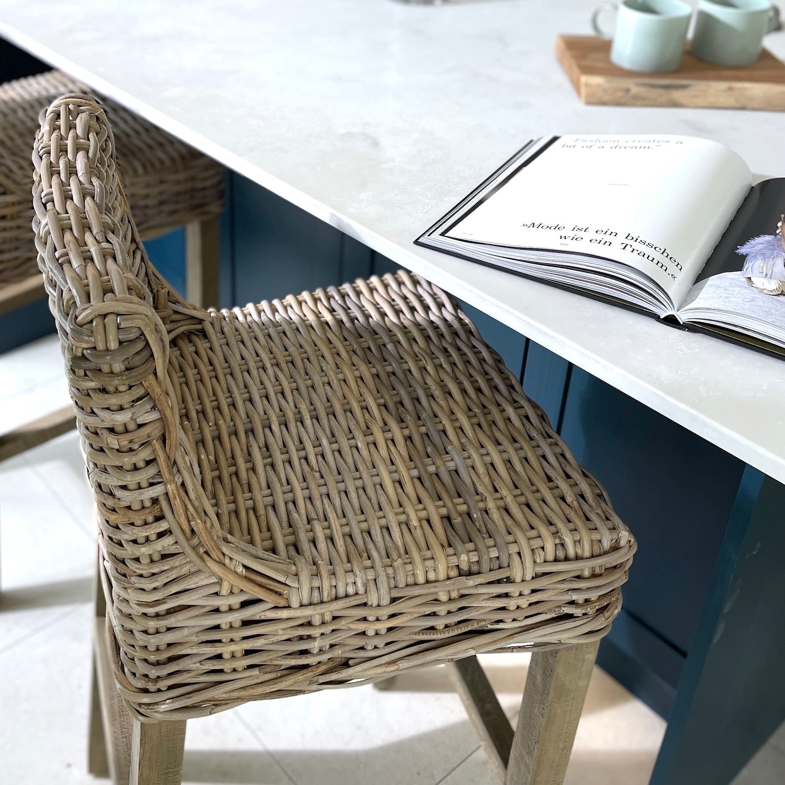 detailed shot of rattan kitchen stool at kitchen island