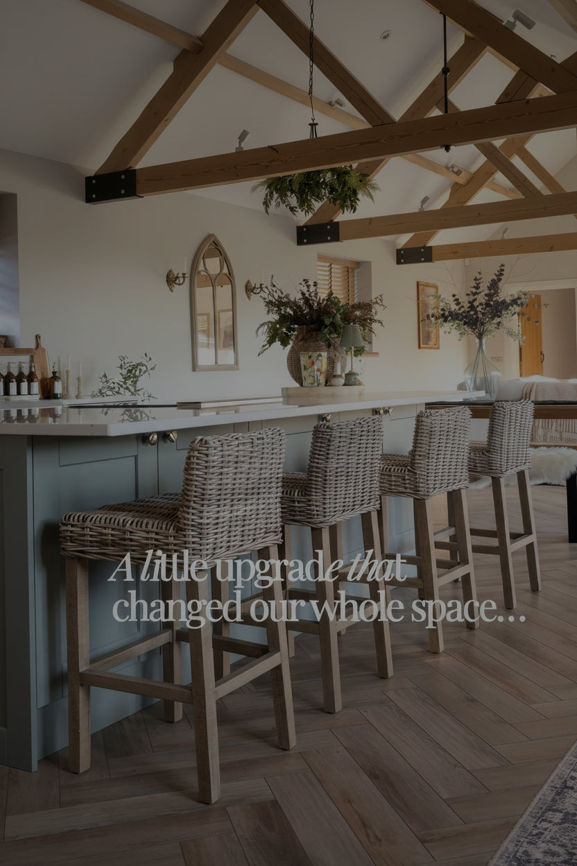 Load video: barn conversion kitchen with lady unpacking her rattan kitchen stools
