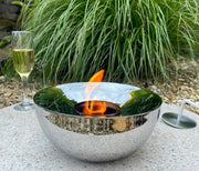 Silver outdoor gel lamp in garden with drink and nature