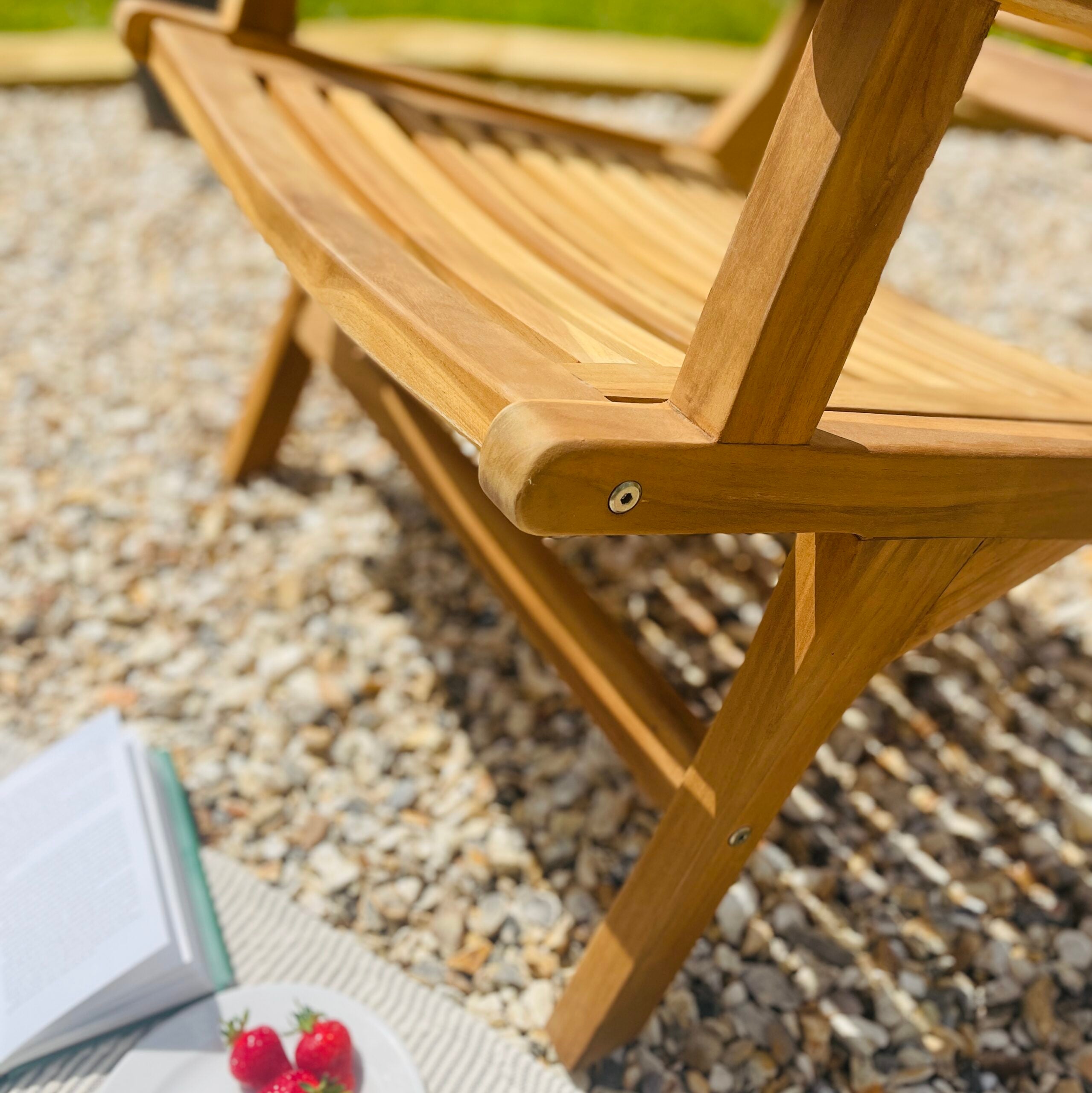 Teak garden chair detailed photo of wood on patio