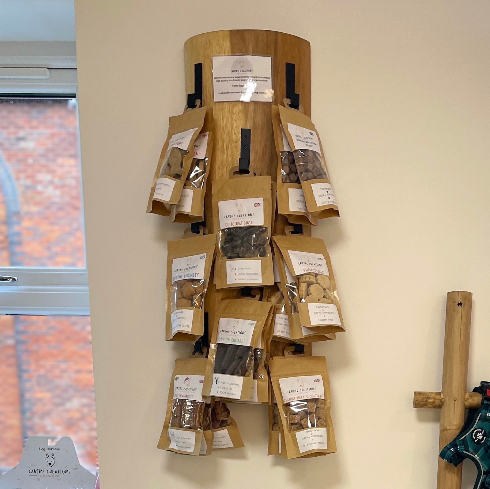 Rustic wall hook with dog treats hanging from it