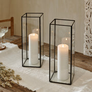 Glass terrarium lantern on cotton runner on wooden table