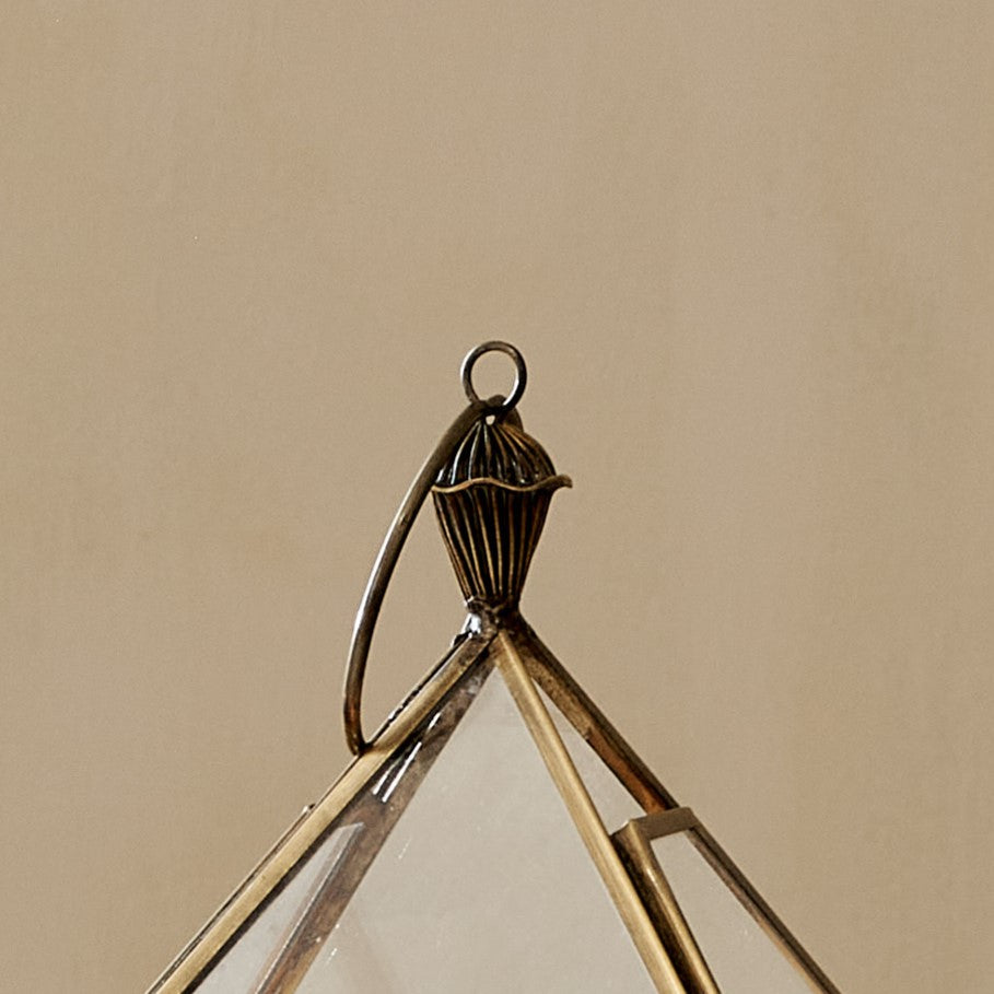 Close up of top of brass candle lantern