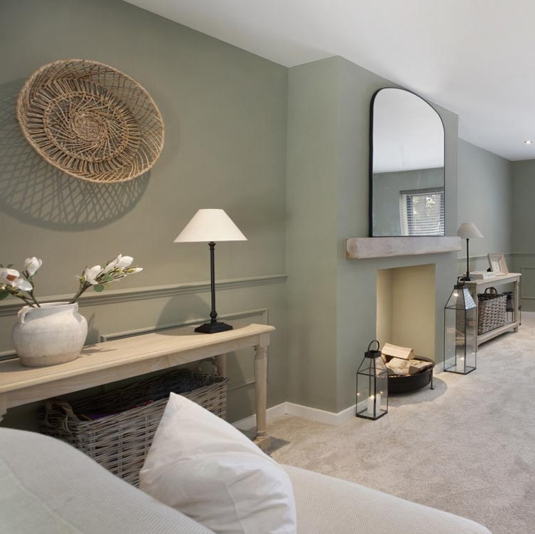 living room with green wall and accessories