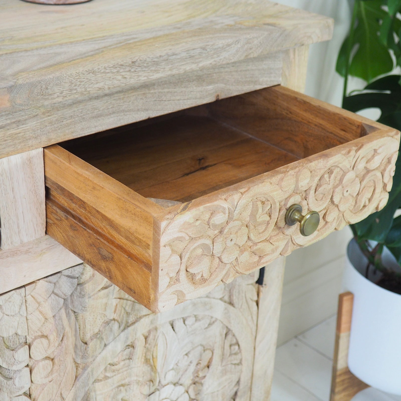 wooden drawer of wooden sideboard with