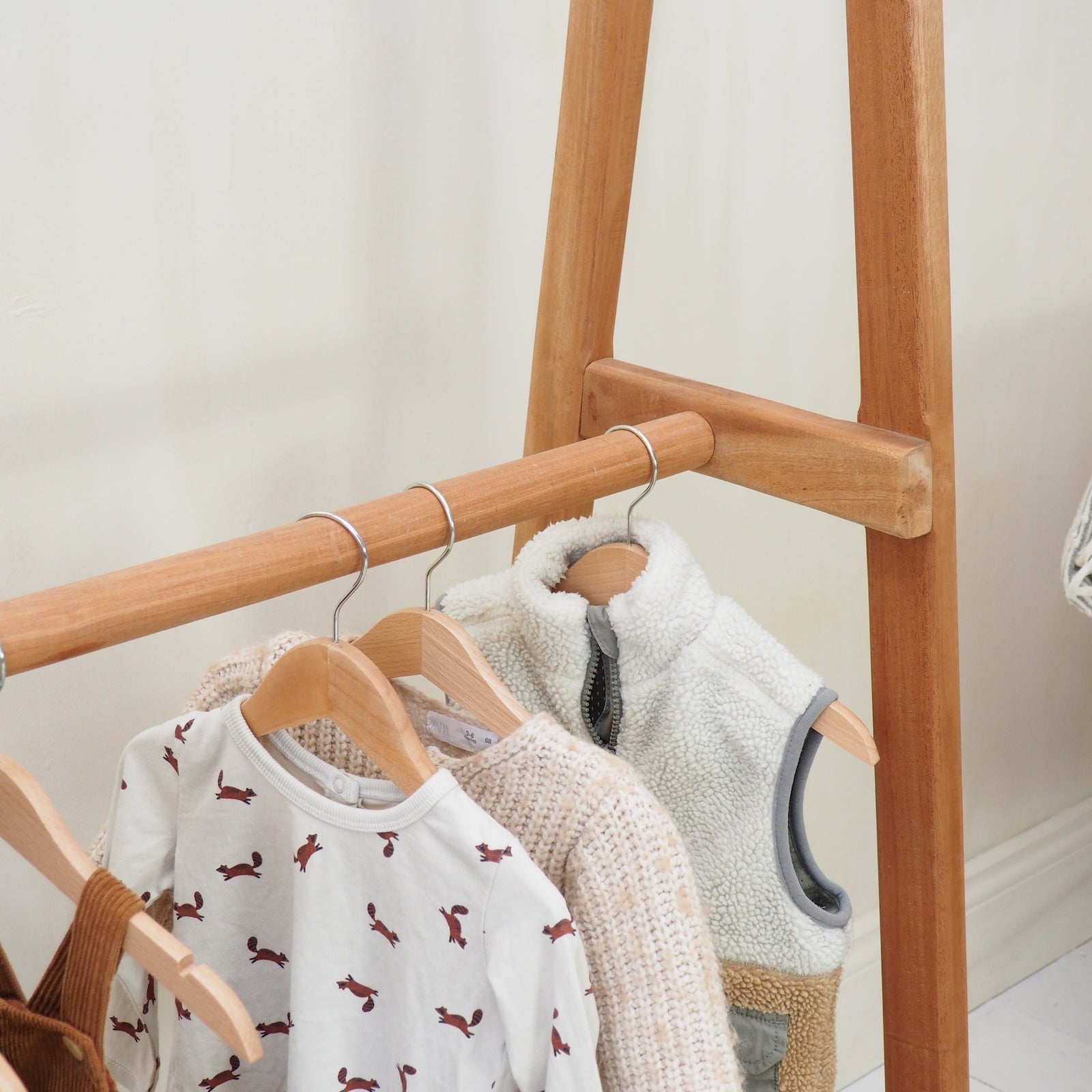 detailed photo of children clothes hanging on a clothes rail
