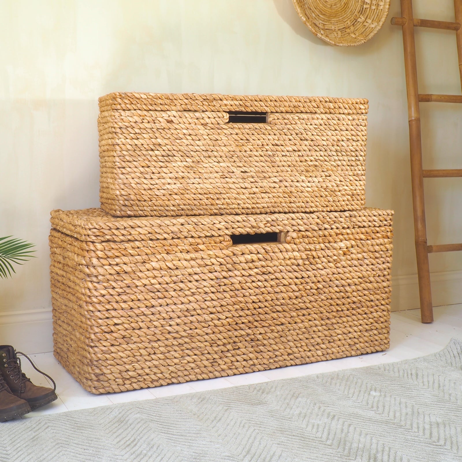 Rattan storage bench stacked in hallway