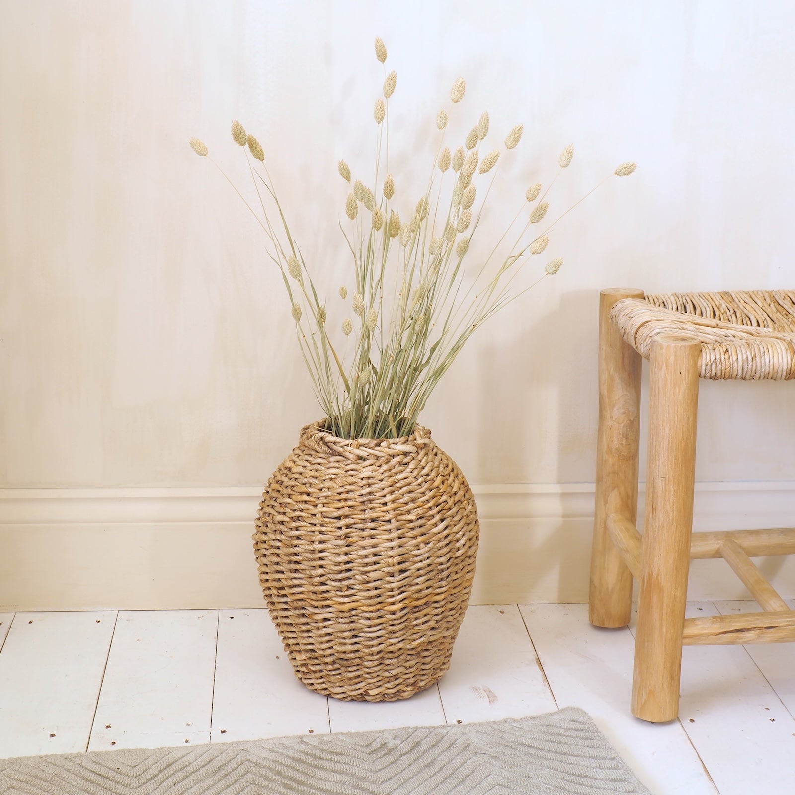 dried flower vase wicker in hallway