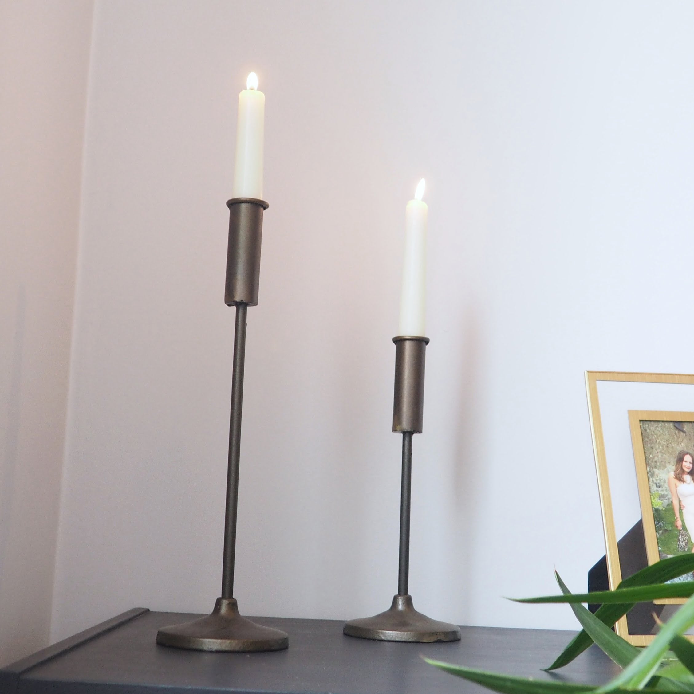 Antique iron candle holder