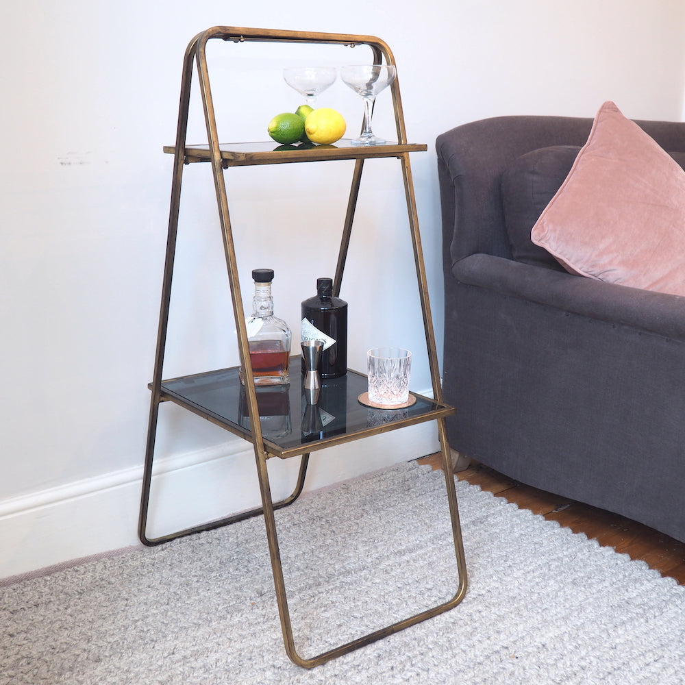 Elegant Brass Shelving Unit with Drinks