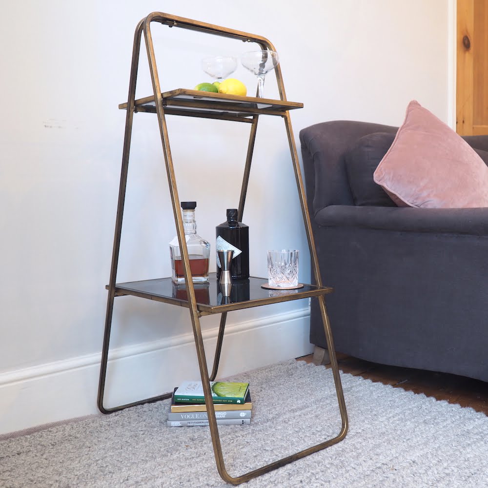 Elegant Brass Shelving Unit Next to Sofa