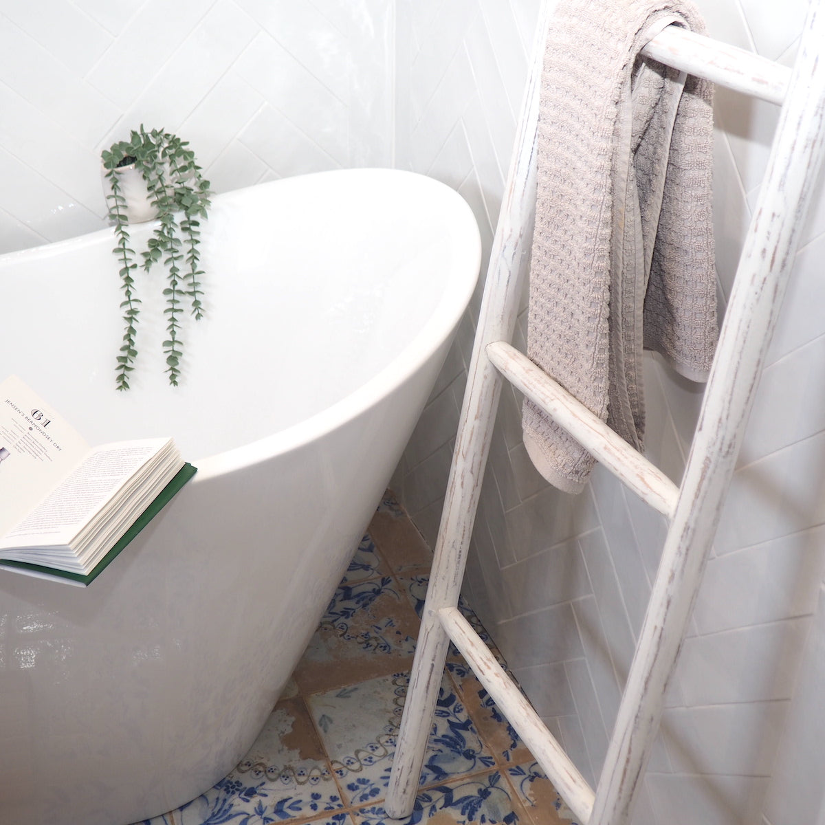 wood towel ladder in bathroom setting
