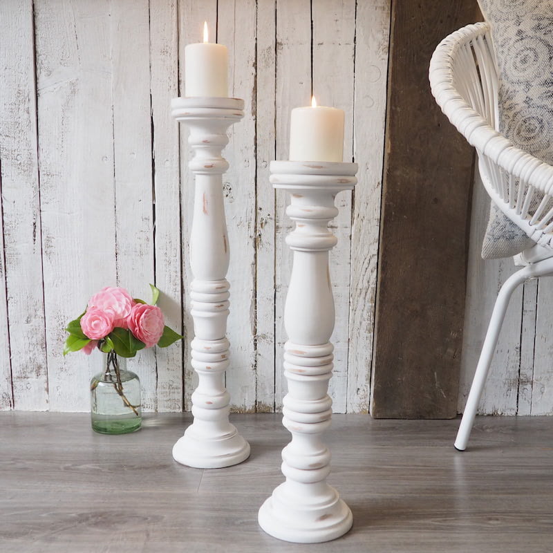Tall white carved wooden candleholders