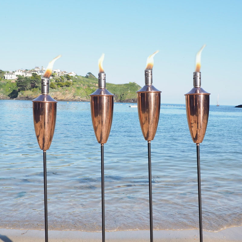 Tall copper garden torches
