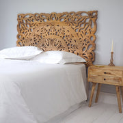 Carved Wooden Headboard on Bed and Cabinet