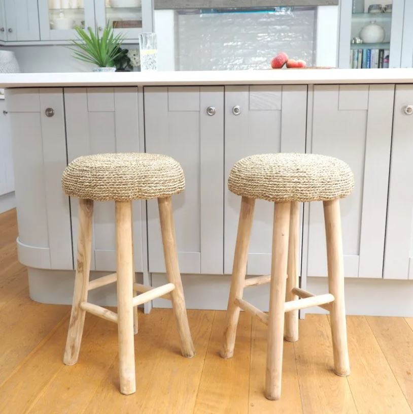 two seagrass wicker kitchen stools at grey kitchen island
