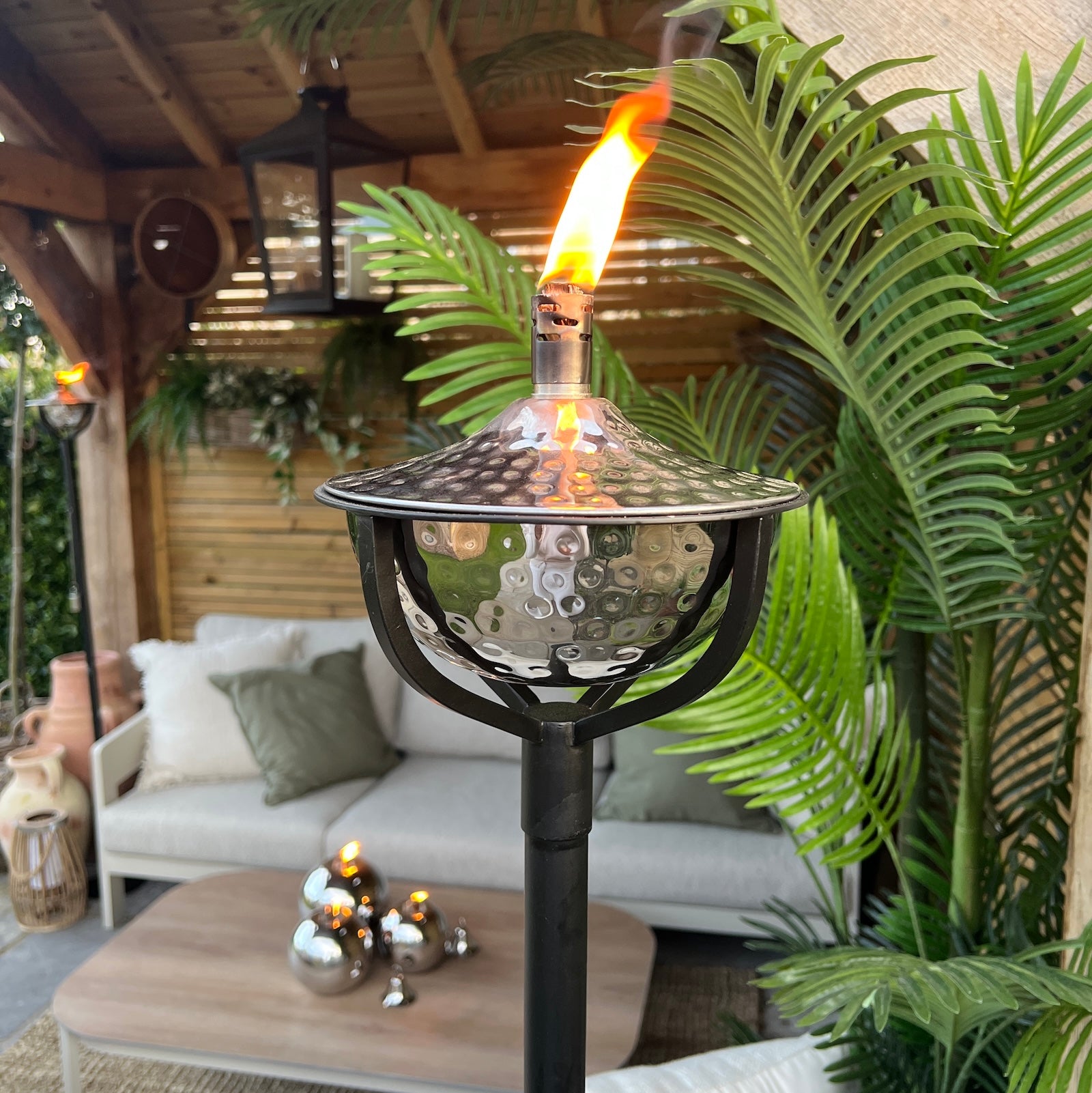 garden oil torch with flame on garden patio
