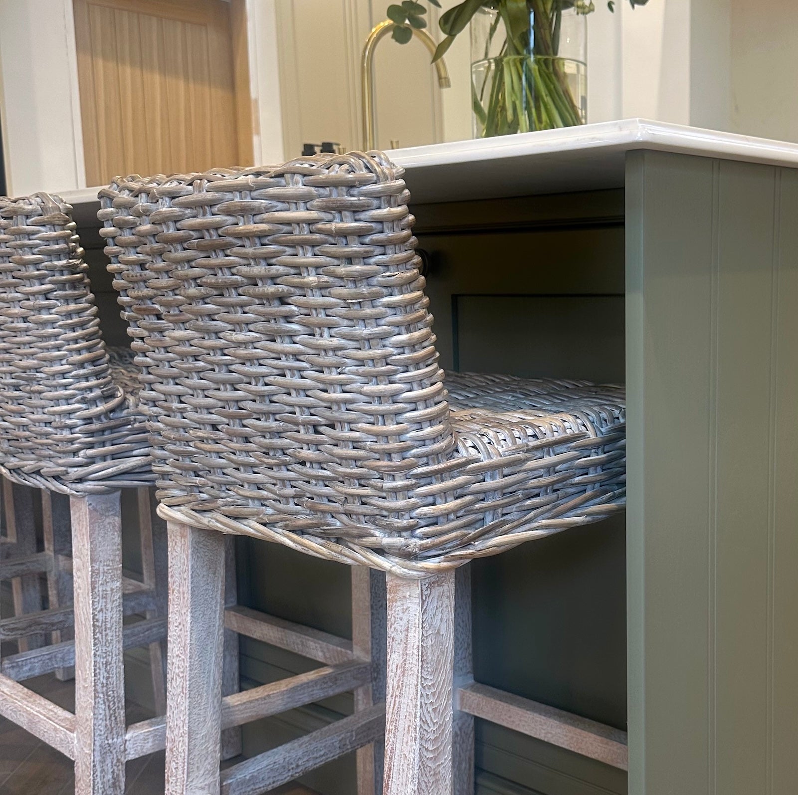 rattan kitchen stool whitewash at green kitchen island