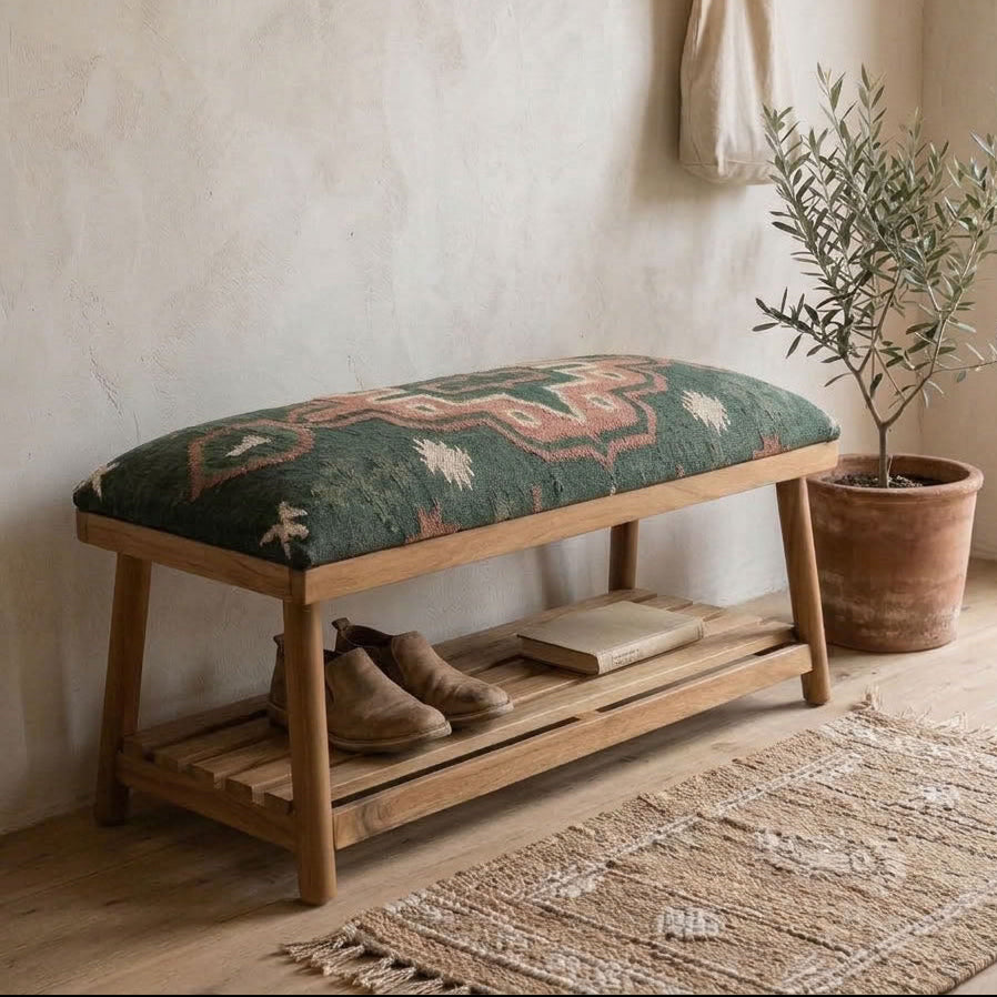 wooden hallway bench with shoe shelf with a uphoulstered green seat. neutral decor in the hallway.