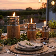 Three oil lamps table setting outdoors
