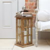 Tall wood lantern - mango wood candle lantern on floor by door and sofa