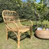 Rattan lounger chair in garden