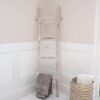 Striped Wicker Basket in Bathroom with wooden towel rack