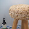 Close up of wicker seat on bathroom stool