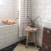 Rustic Wooden Stool in bathroom with plant