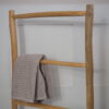 Free Standing Wooden Towel Rack with grey towel